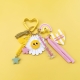 Porte-clés grigri Maman soleil coloré avec marguerite et arc-en-ciel