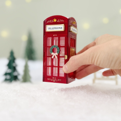 Cabine téléphonique rouge miniature de Noël