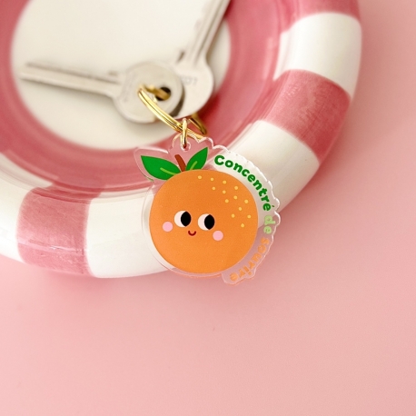 Porte-clés orange concentré de sourire